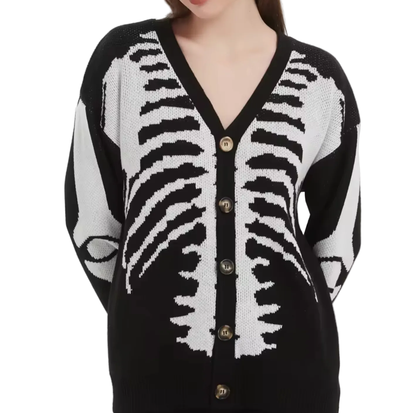 A woman wearing a black and white knit cardigan with a rib cage pattern and brown buttons, shown against a plain light gray background.
